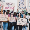 Stock photo of climate change protesters with signs