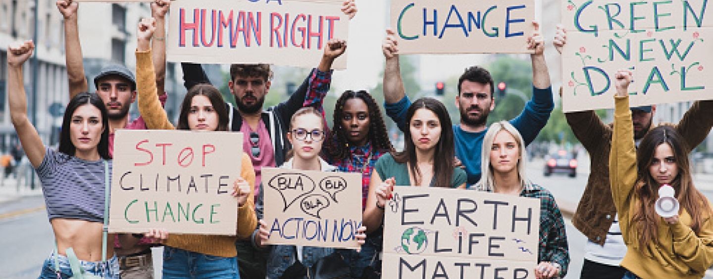 Stock photo of climate change protesters with signs